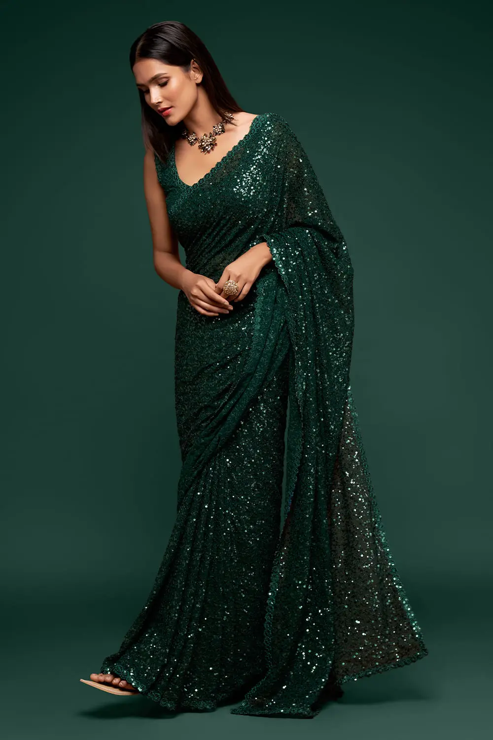 Deep green sequin georgette saree with pallu draped full view