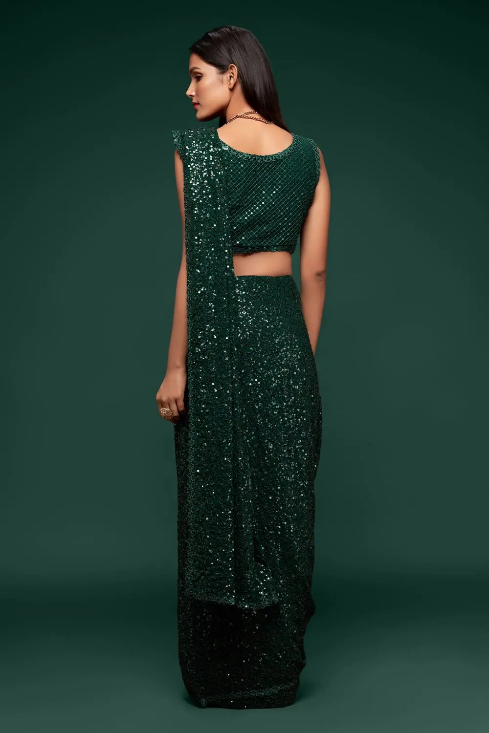Back view of deep green georgette saree with sequin work