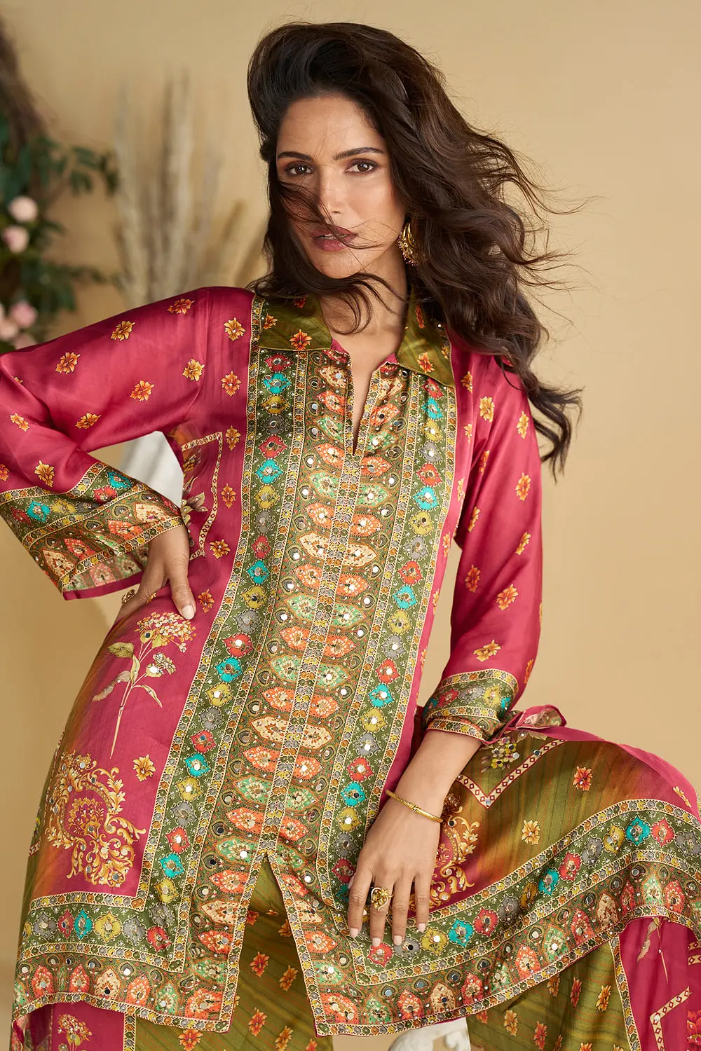 Close up of hand mirror work and digital print on the light green and pink asymmetric crepe silk kurta