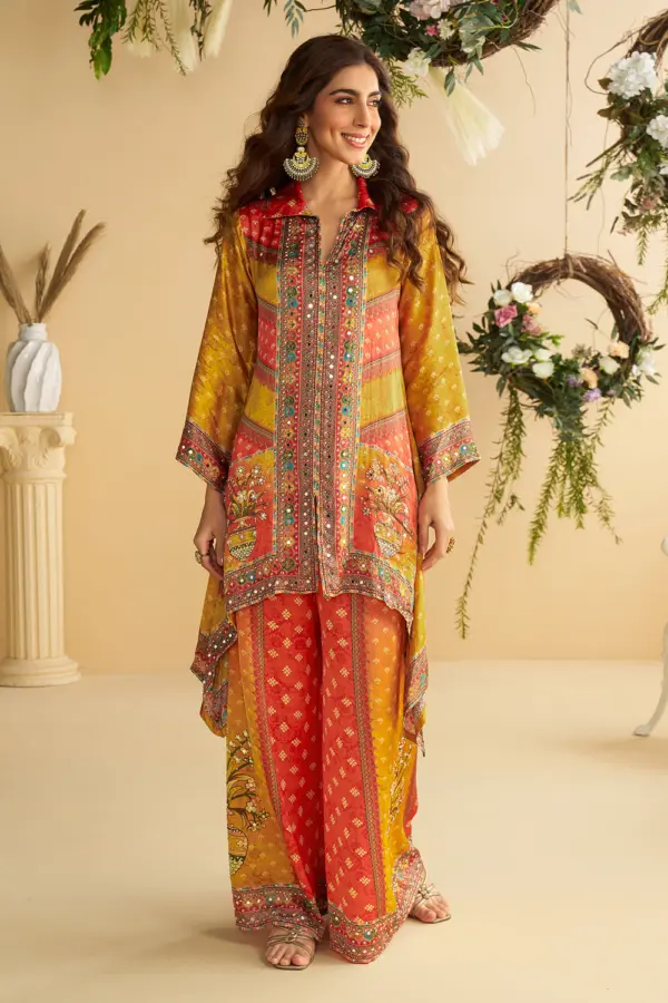 Orange and yellow crepe silk palazzo set with mirror work embellishment by Khaish