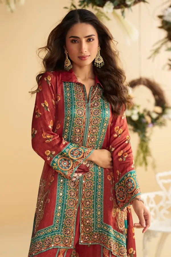 Close up of hand mirror embellishment on the rust and teal blue crepe silk kurta