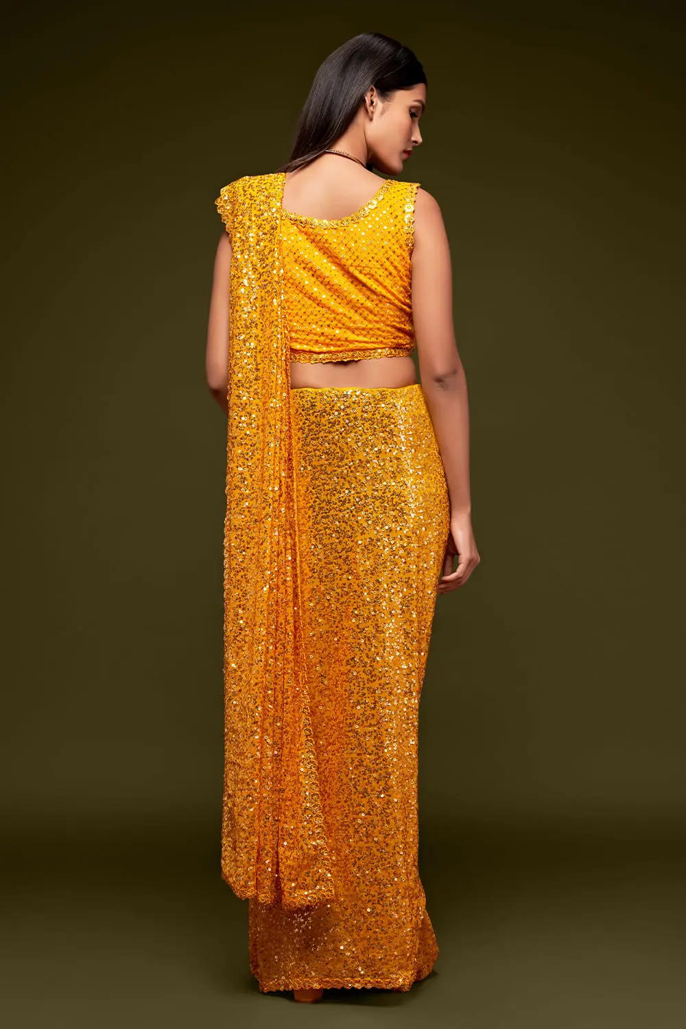 Back view of honey yellow georgette saree with sequin work