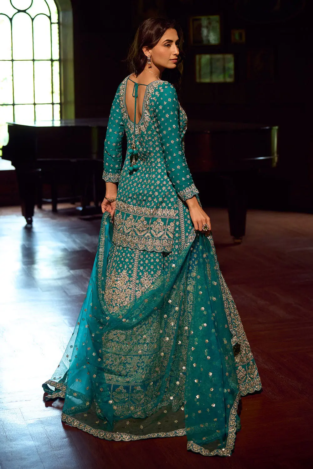 Back view of teal blue kurti lehenga showing full back mirror embroidery coverage