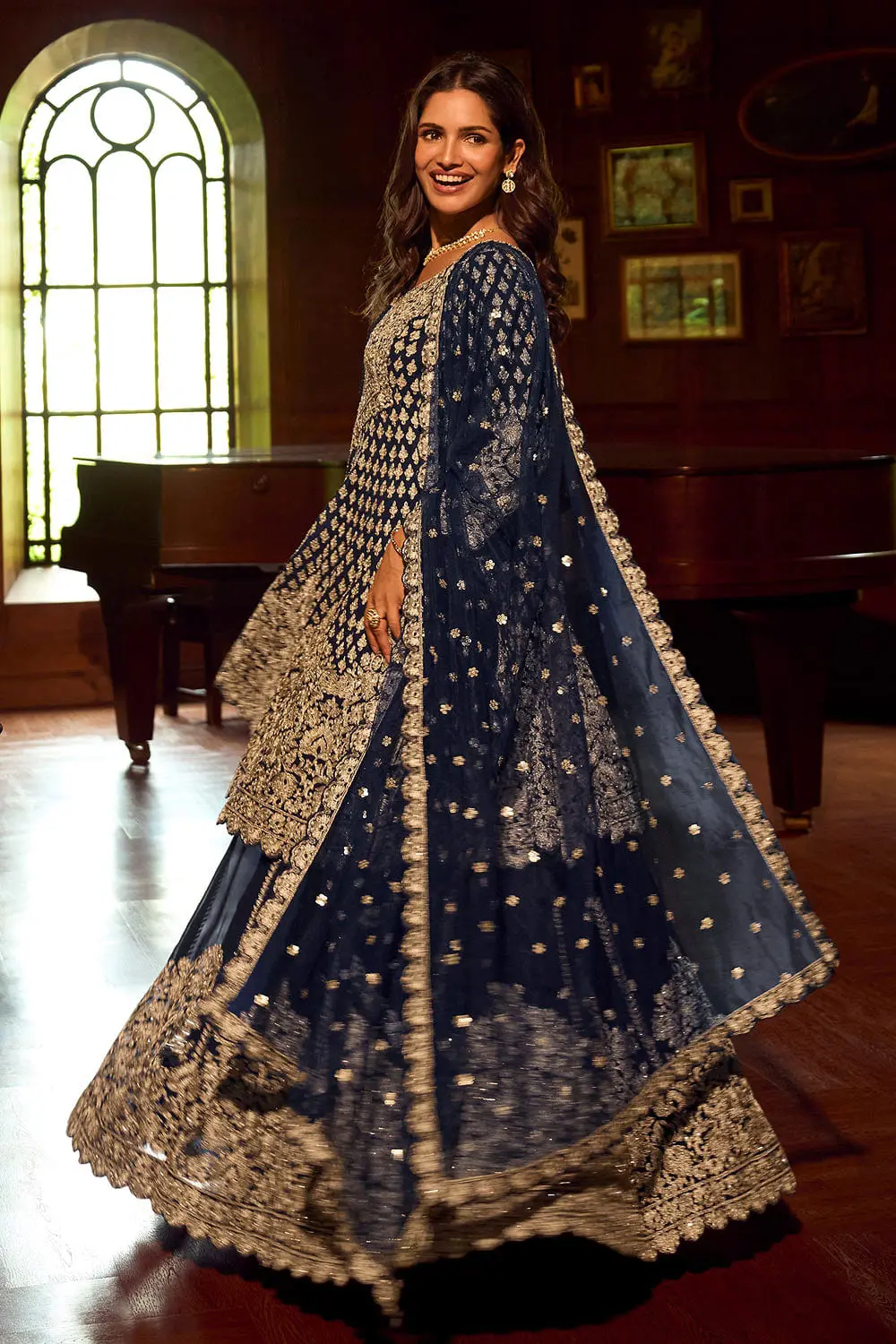 Side view of deep purple kurti lehenga showing the full length and can-can skirt volume