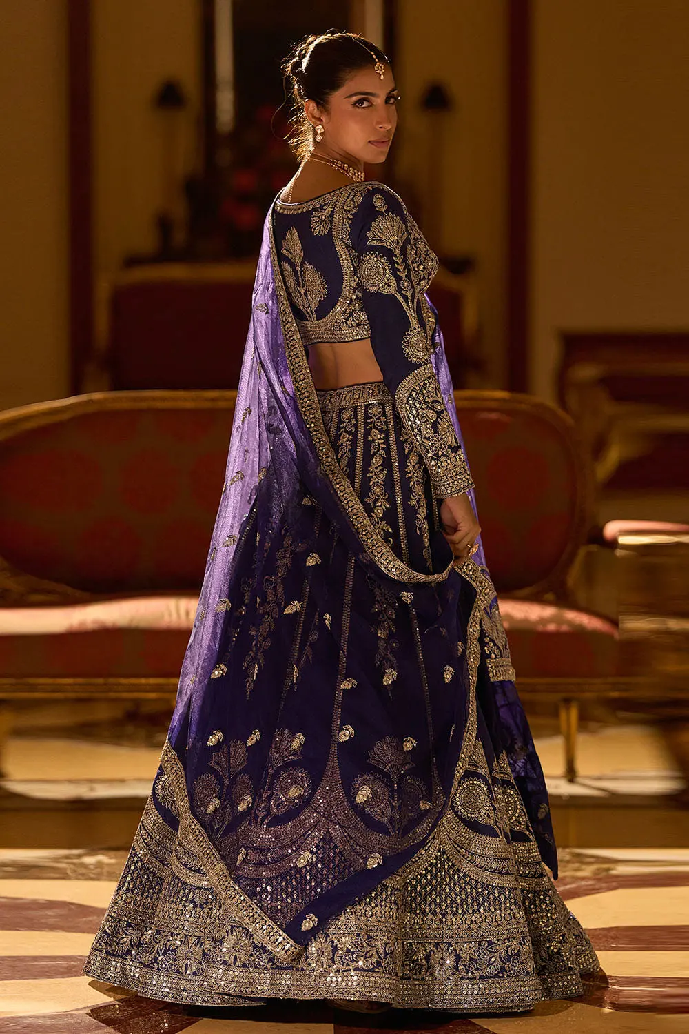 Back full view of navy blue silk lehenga with embroidered silk dupatta
