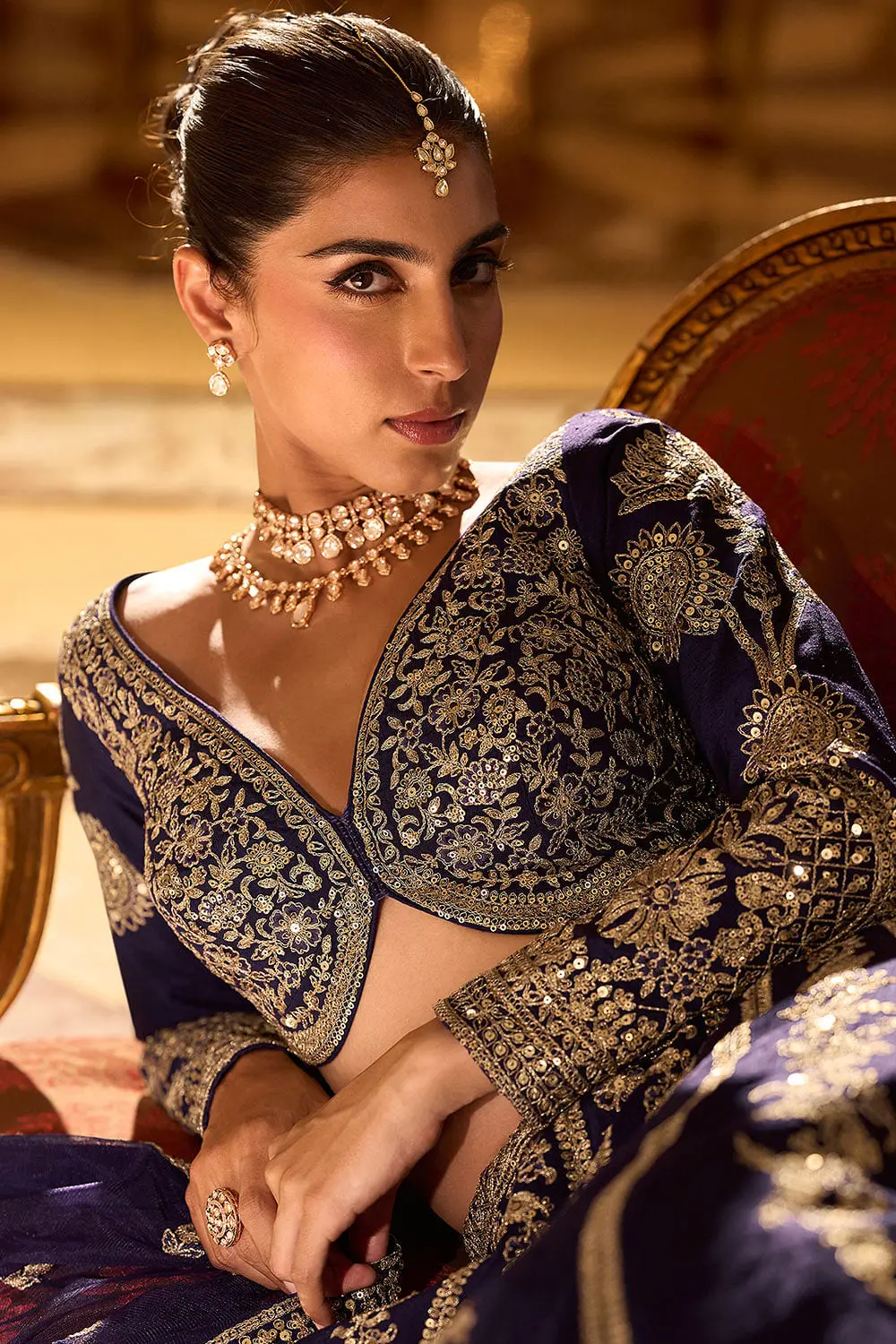 Close up of shisha mirror detail on navy blue silk lehenga bodice