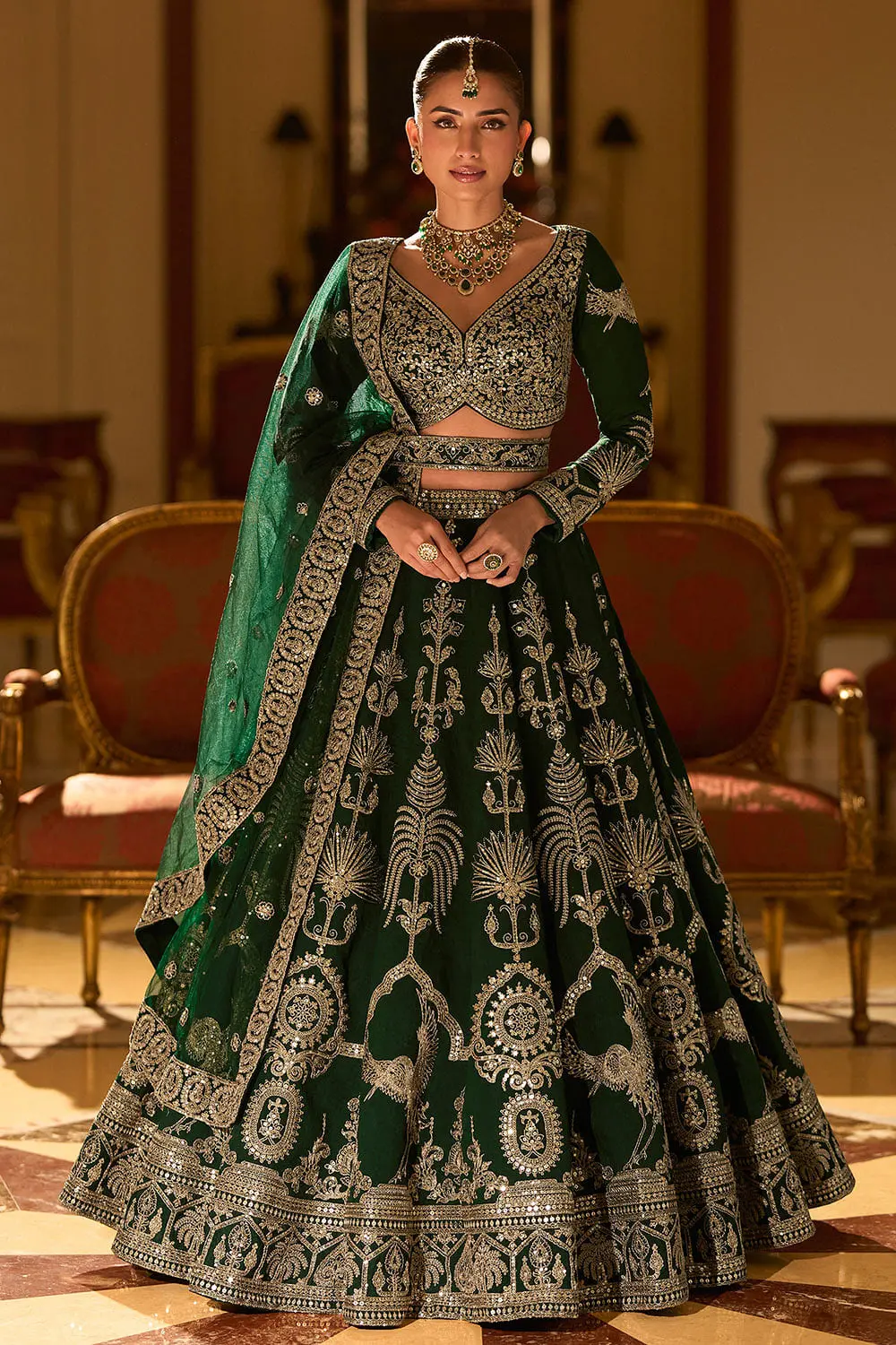 Deep green silk lehenga for sangeet with hand mirror embroidery by Khaish