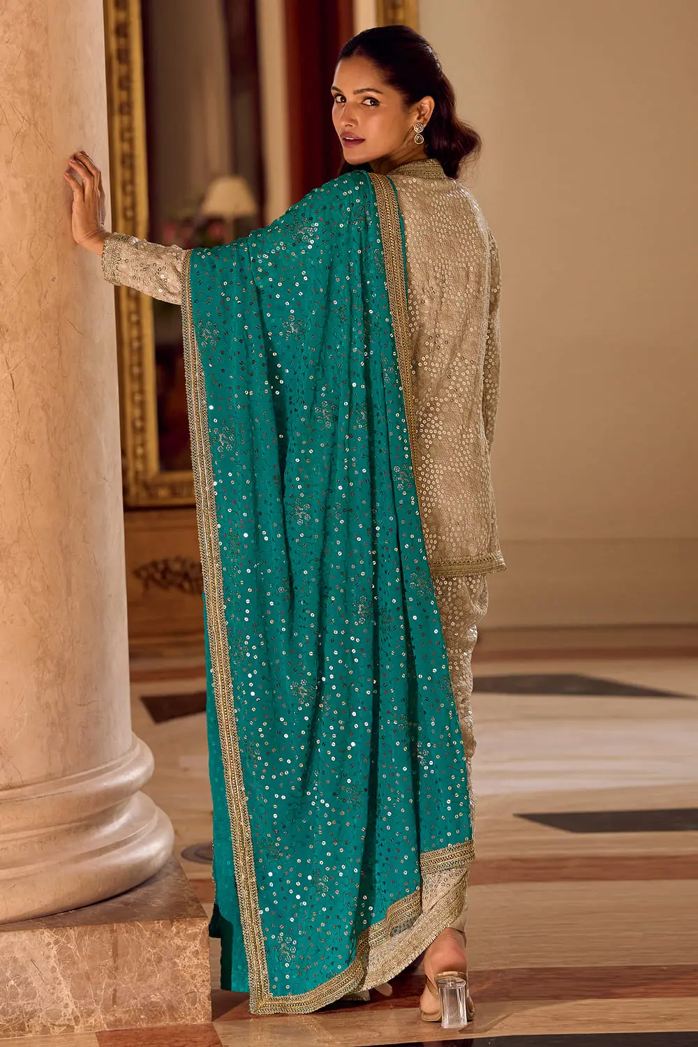 Elegant back layout of the designer beige dhoti salwar dress showing the fine drape and fit.