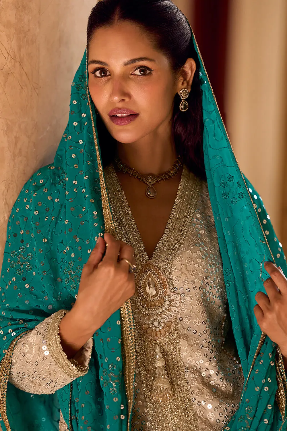 Intricate hand work and sequins embroidery detailed close up on the premium georgette fabric.