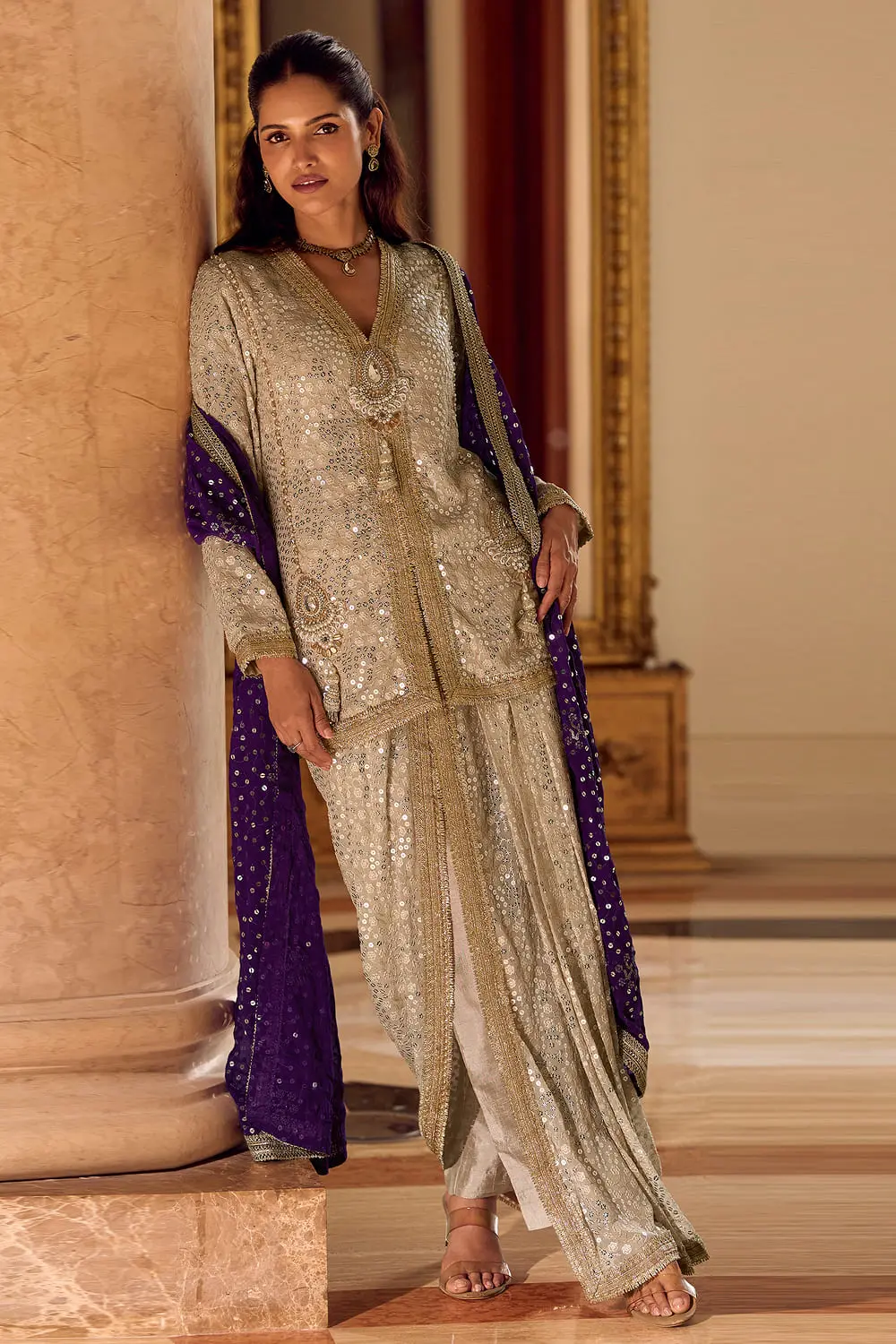 Full front shot of the premium beige embroidered tunic and pleated dhoti pants.