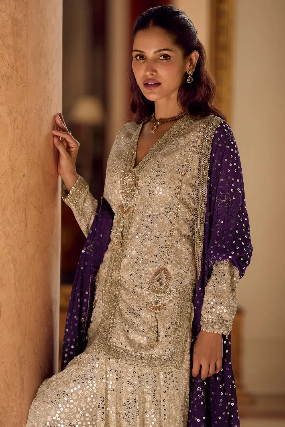 Detailed close up of heavy sequins and hand work embroidery on premium georgette fabric.
