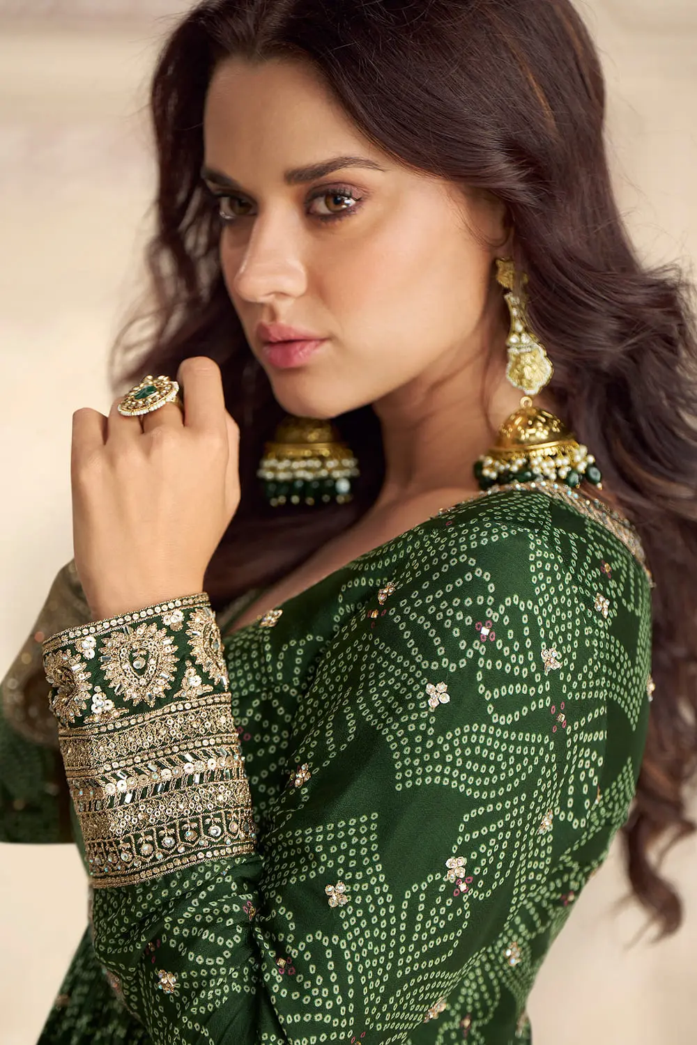 Side close up of bandhani print and embroidery on green chinon silk anarkali gown