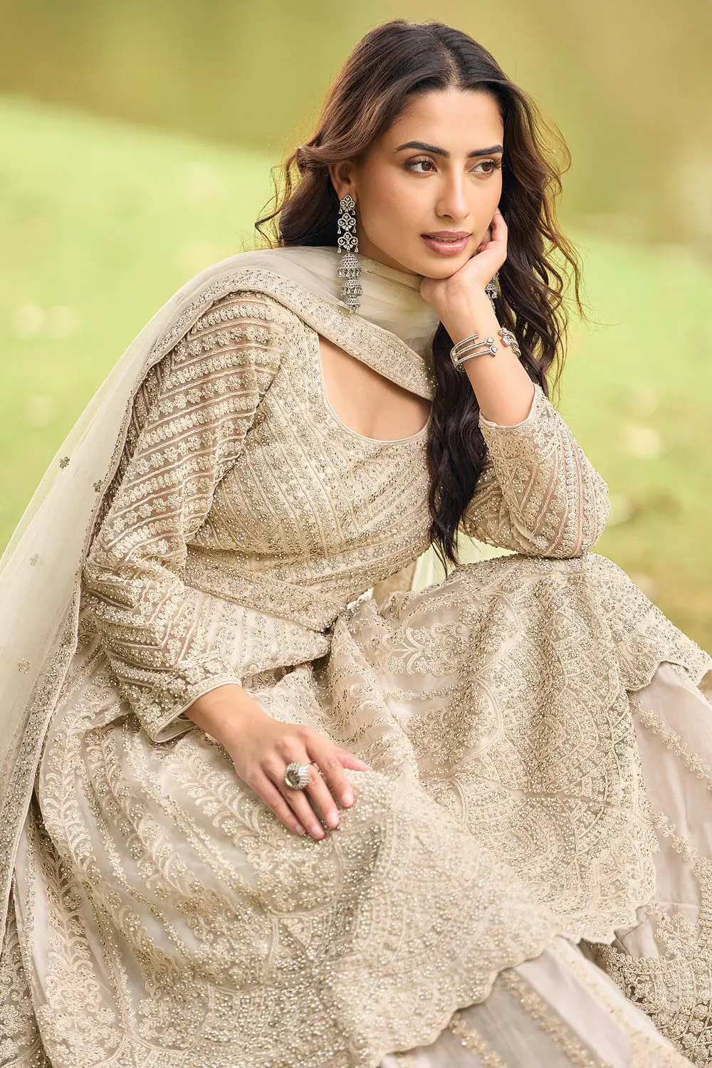 Close up of front beads embroidery and diamond touch-up on beige premium net kurta top