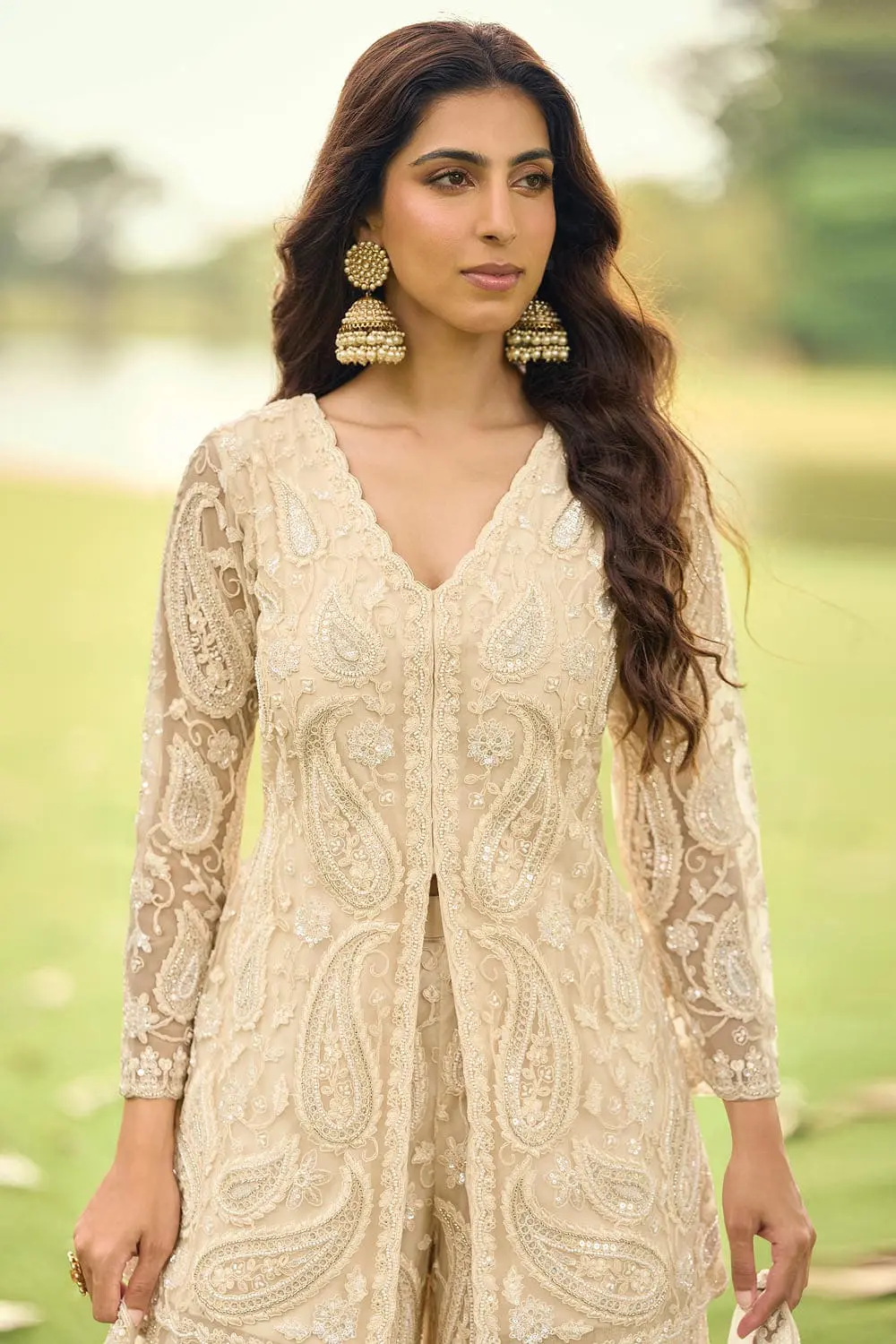 Close up of front beads embroidery and diamond touch-up on light gold premium net kurta