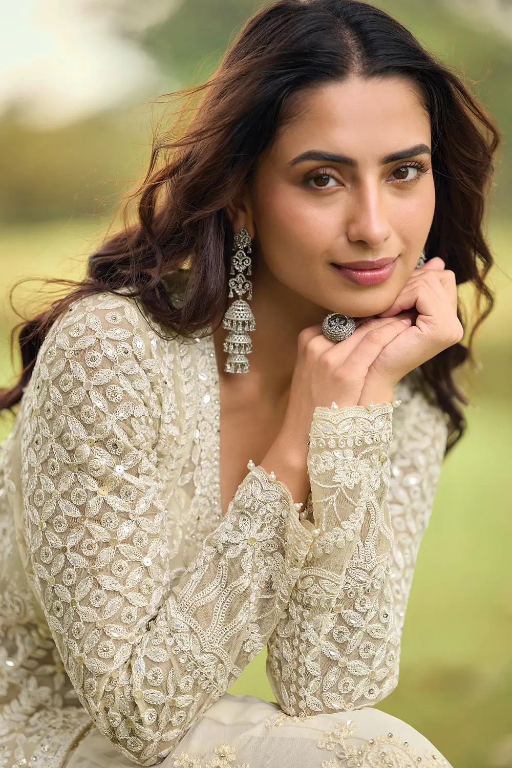 Close up of front beads embroidery and diamond touch-up on ivory premium net kurta top