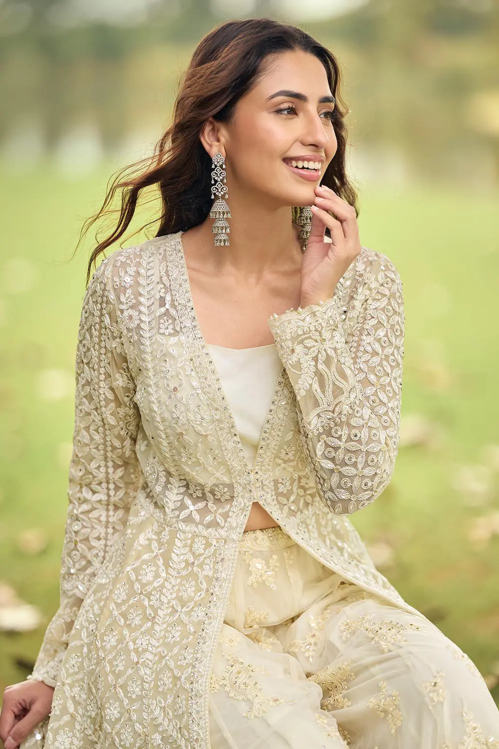 Close up of heavy beads embroidery on ivory net palazzo and dupatta surface