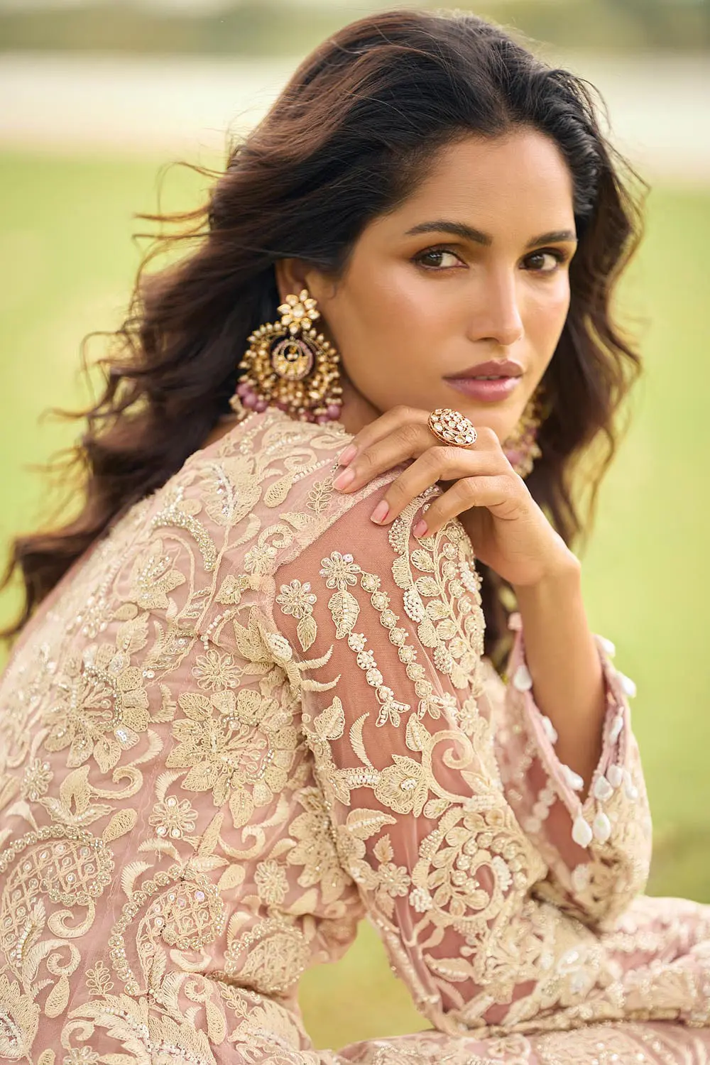 Close up of heavy beads embroidery on dusty pink net palazzo surface