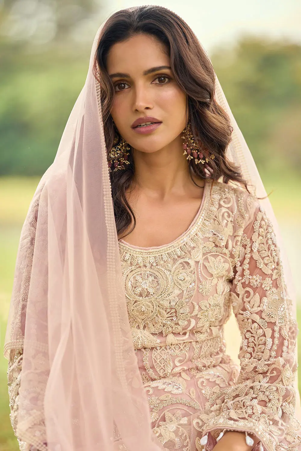 Close up of front beads embroidery and diamond touch-up on dusty pink premium net kurta