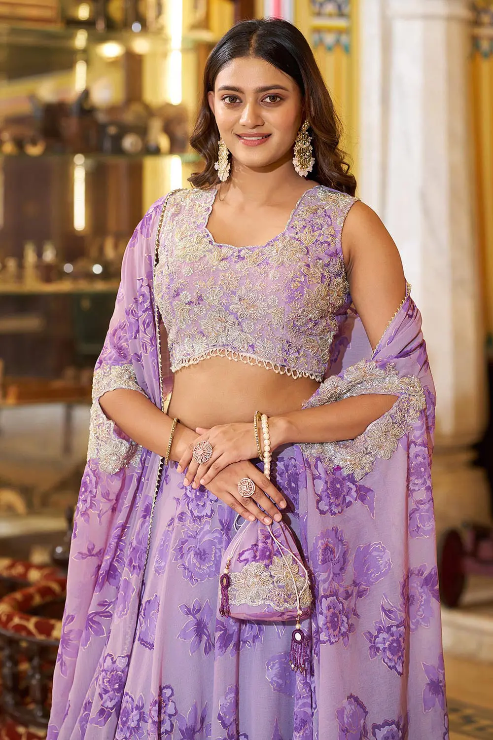 Close up of thread embroidery, sequins and tube beads on lavender lehenga