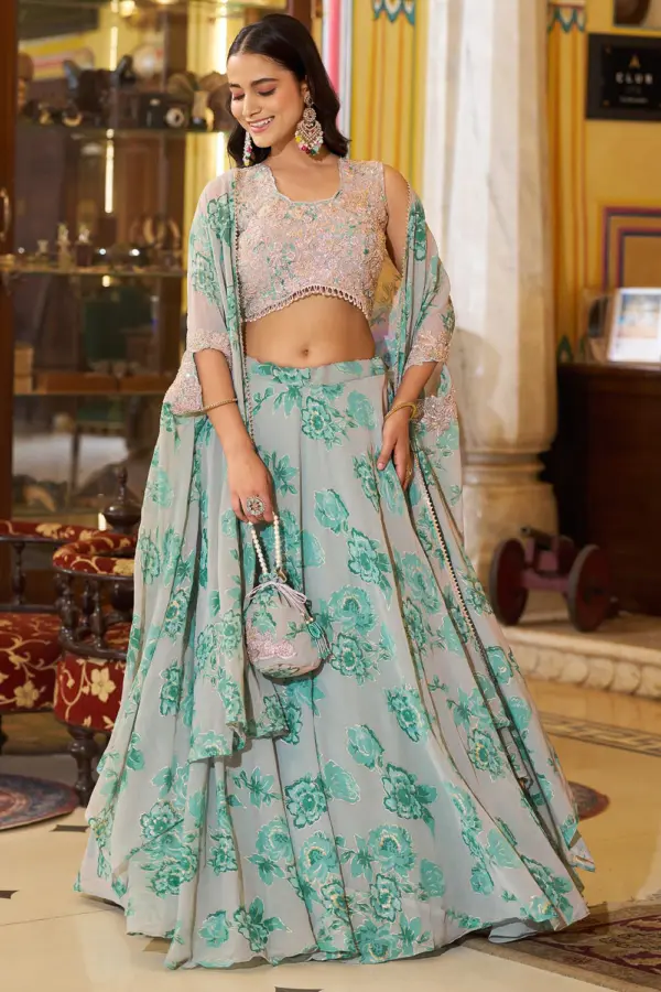 Dusty green cape lehenga for sangeet in floral georgette with sequins by Khaish