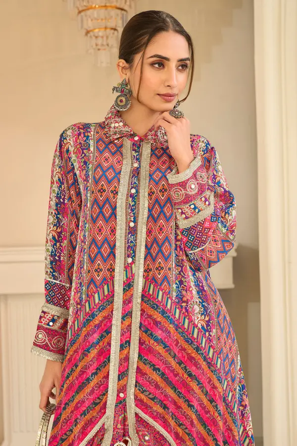 Close up of hand aari embroidery on orange multicolor crepe silk top