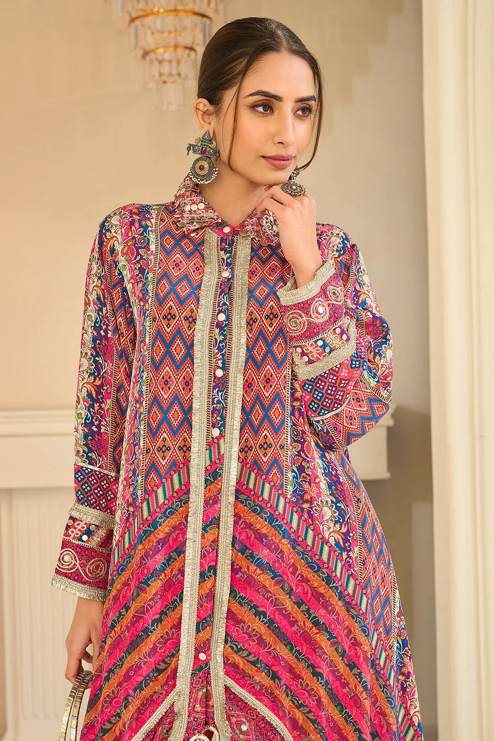 Close up of hand aari embroidery on orange multicolor crepe silk top