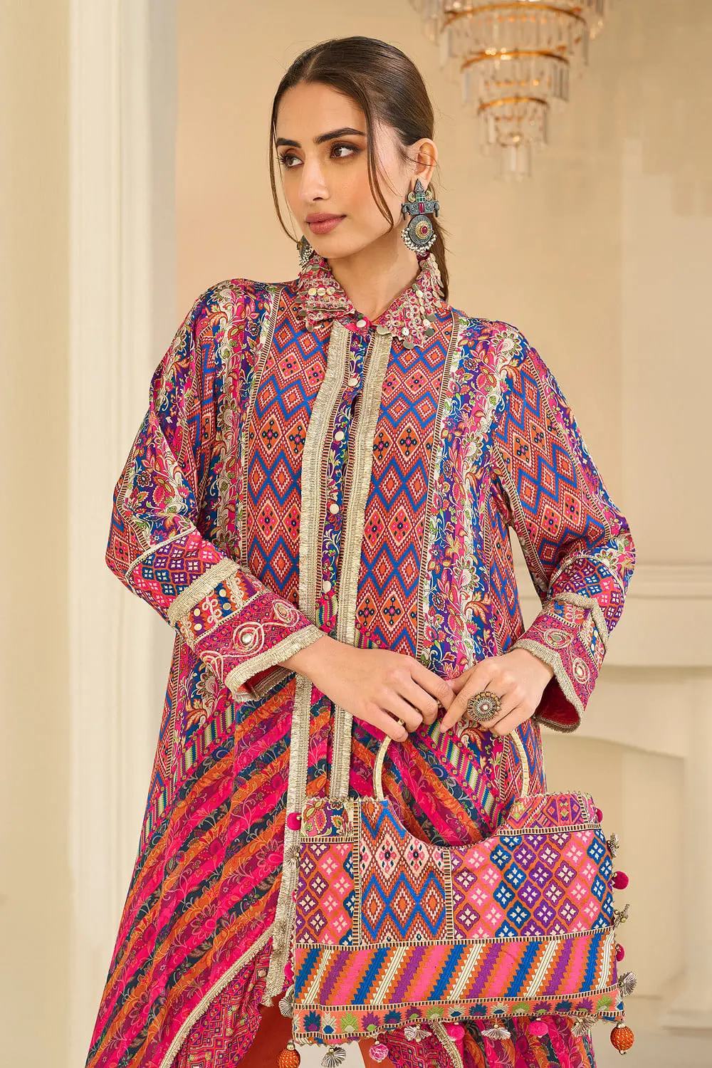 Close up of gota detailing on the orange multicolor kaftan top