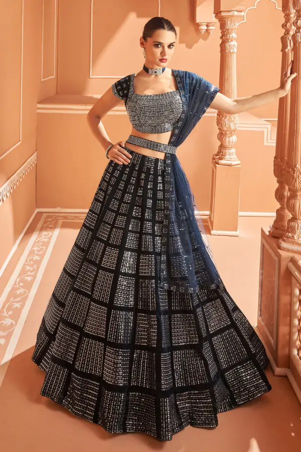 Blue velvet lehenga second front view showing structured belt and full lehenga volume