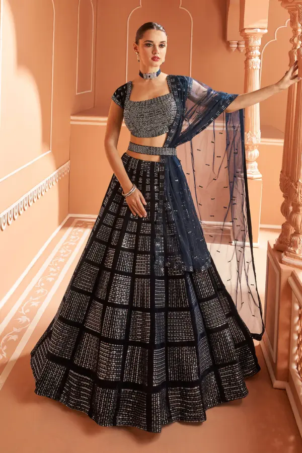 Blue velvet designer lehenga with belt, front embroidery and can-can volume by Khaish