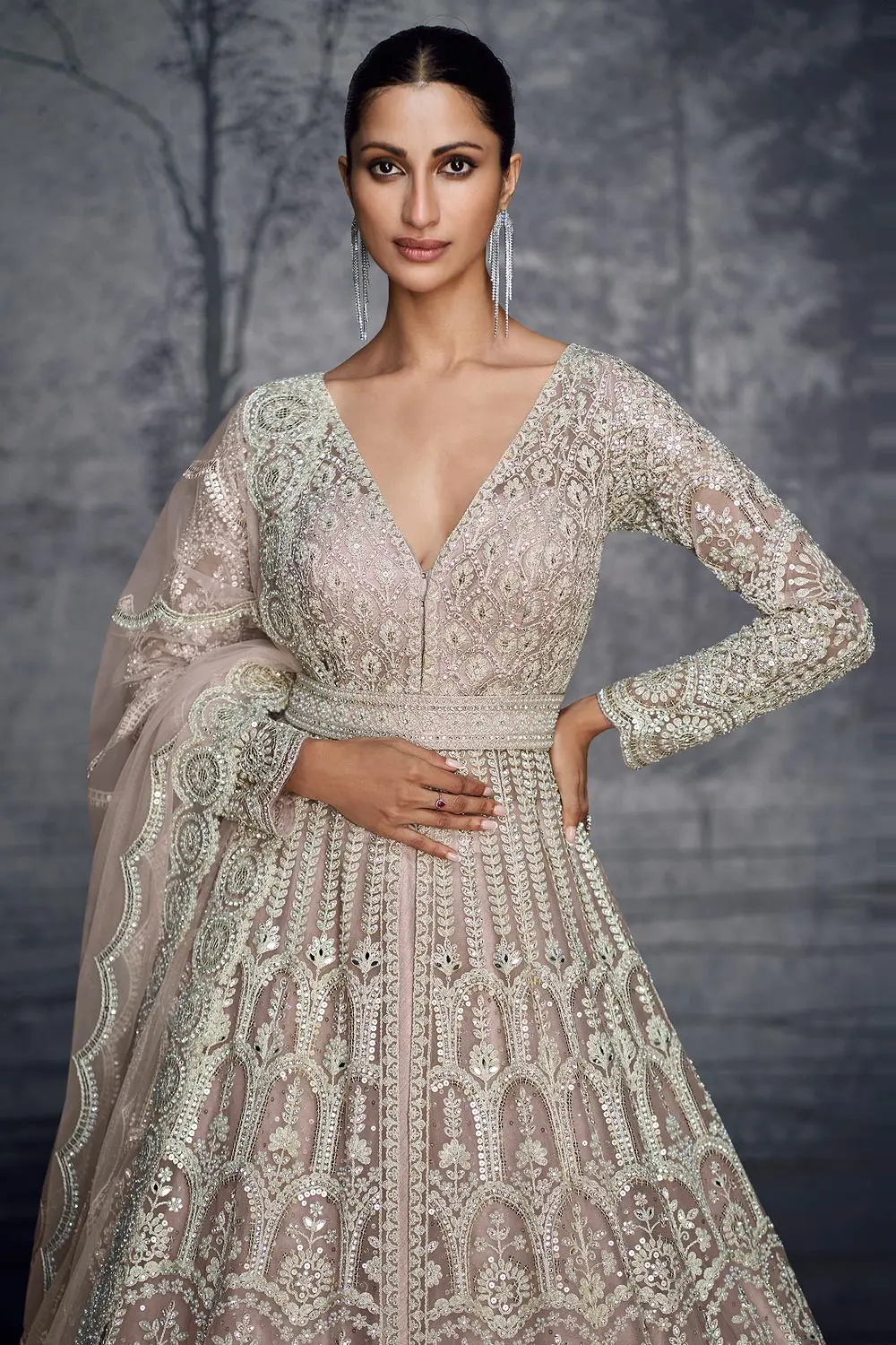 Close up of hand moti and Swarovski diamond work on dusty pink net anarkali