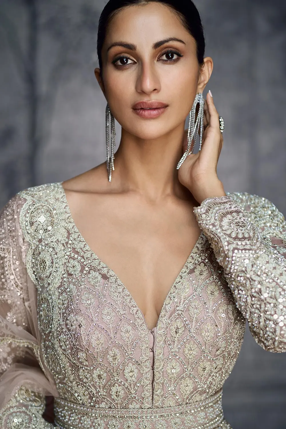 Close up of belt and hand embroidery on dusty pink net anarkali dress