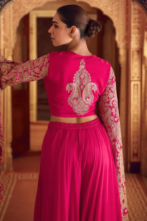 Back view of stitched free size pink fusion dress with heavy embellishments