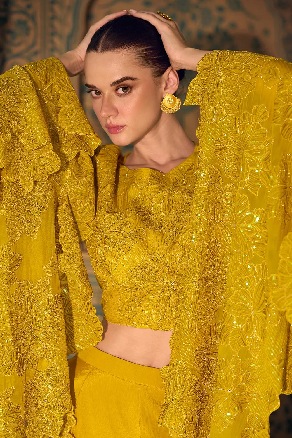 Close up of zari work and long sleeve detail on mustard crop top
