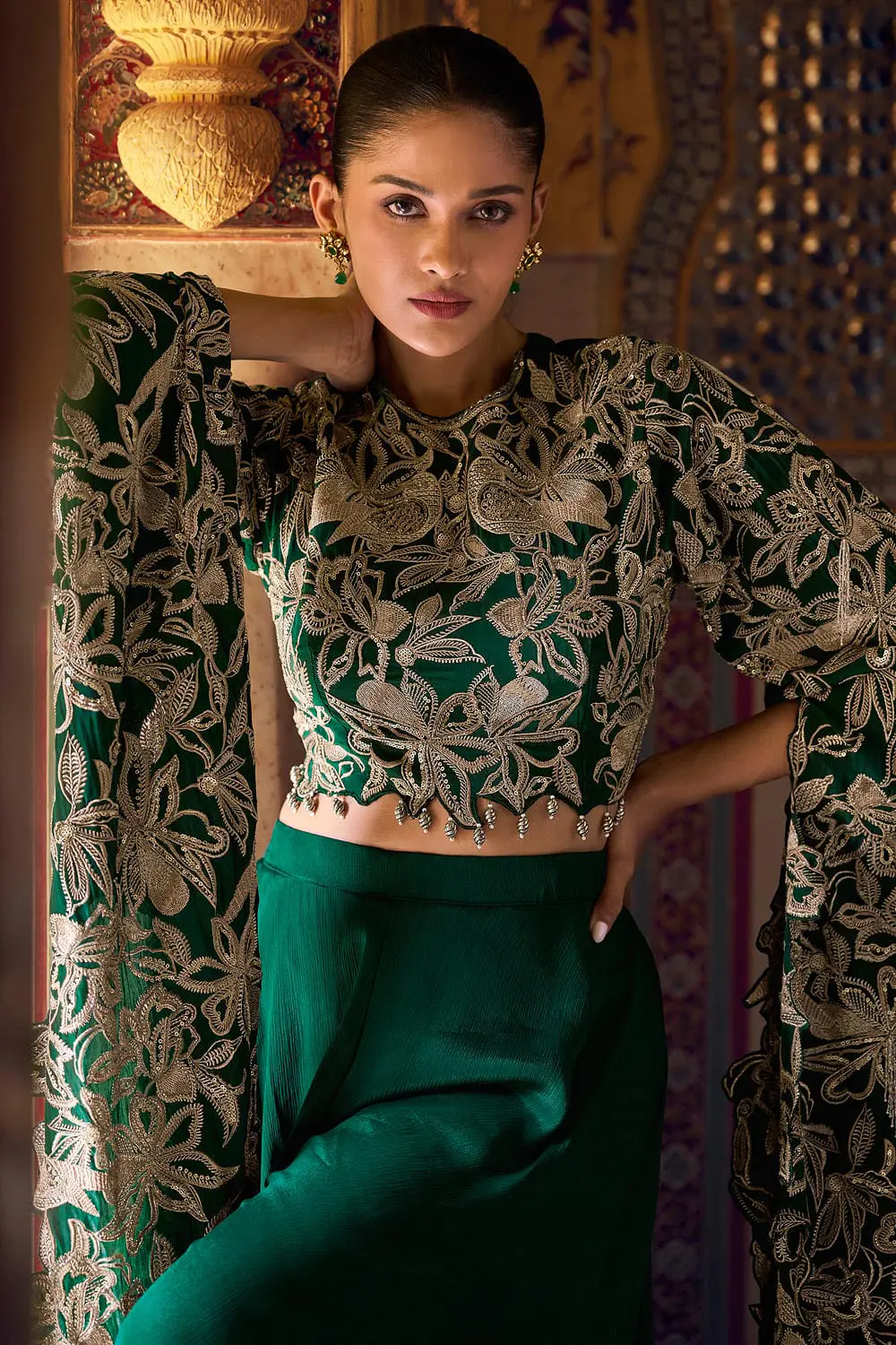 Detailed heavy zari workmanship on green Chinon silk bodice