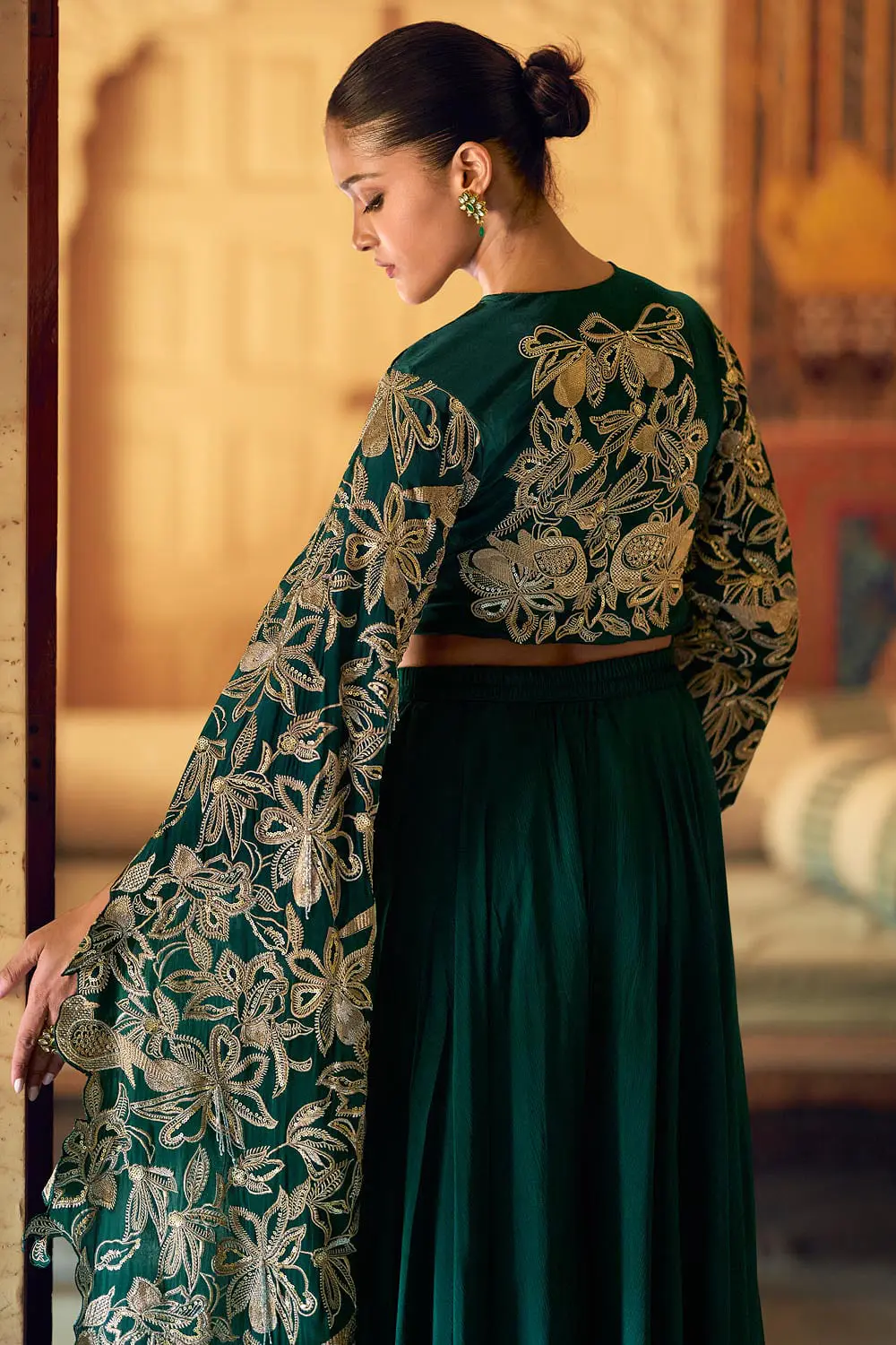 Back view of stitched free size green flowing party wear outfit