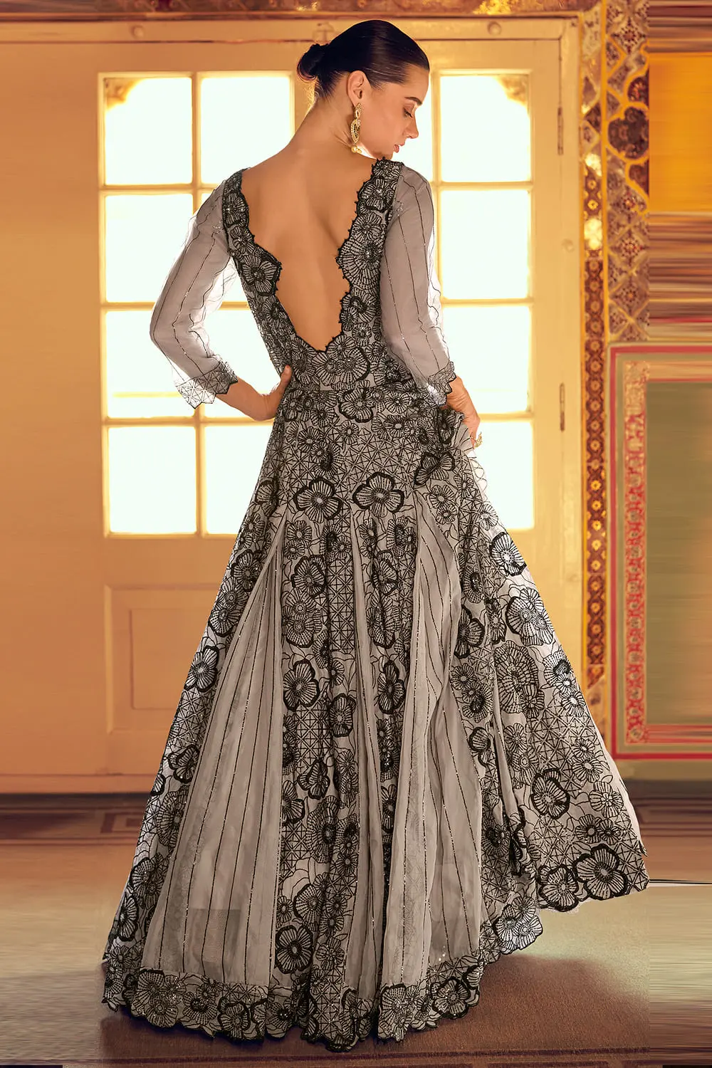 Elegant back view of the flowing grey embroidered indowestern anarkali dress.