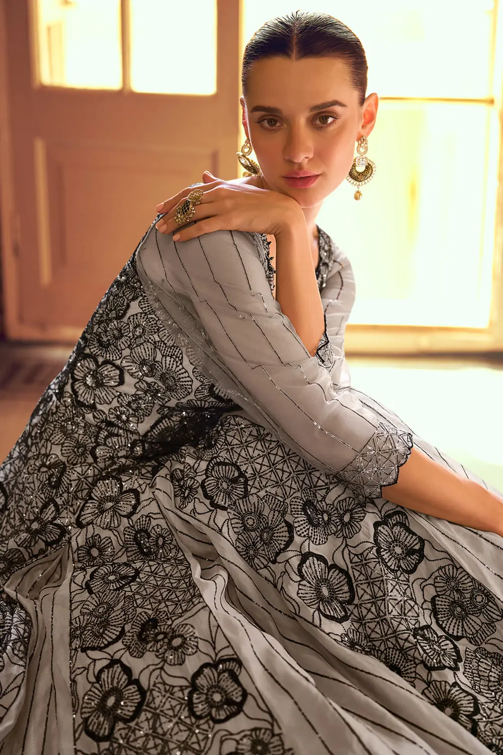 Close up showcasing the sleeve and bodice detailing of the indo western party outfit.