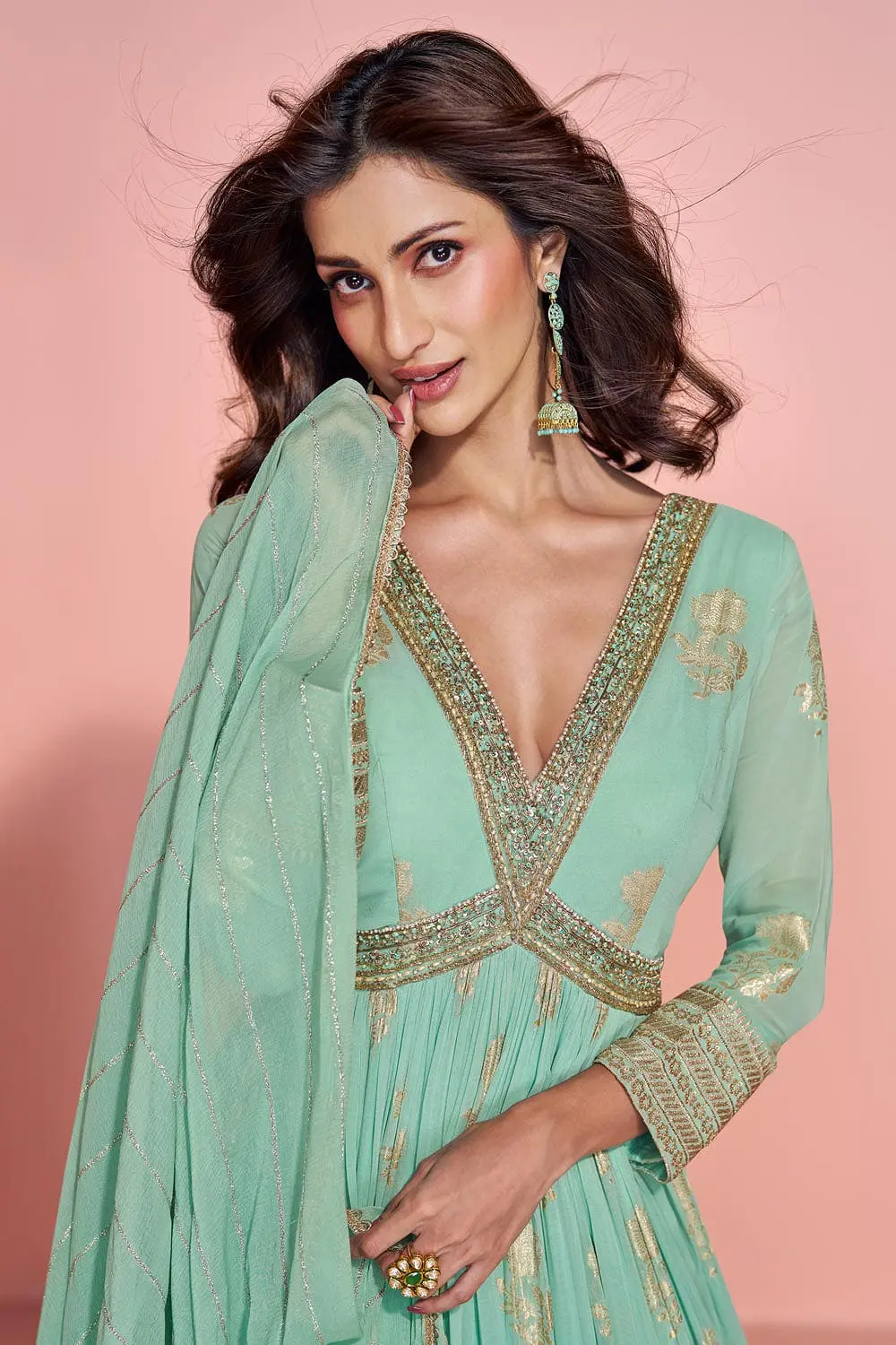 Close up of embroidered jacquard silk dupatta detail with mint green anarkali gown