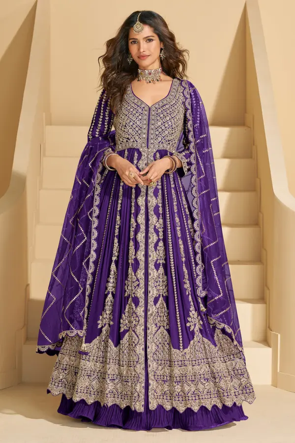 Spectacular full front view of the hot pink chinon silk anarkali with skirt featuring heavy intricate embroidery.