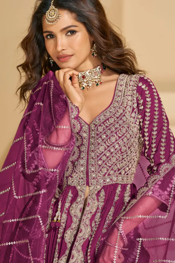 Detailed close-up of the front bodice embroidery on the vibrant hot pink chinon silk ethnic tunic.