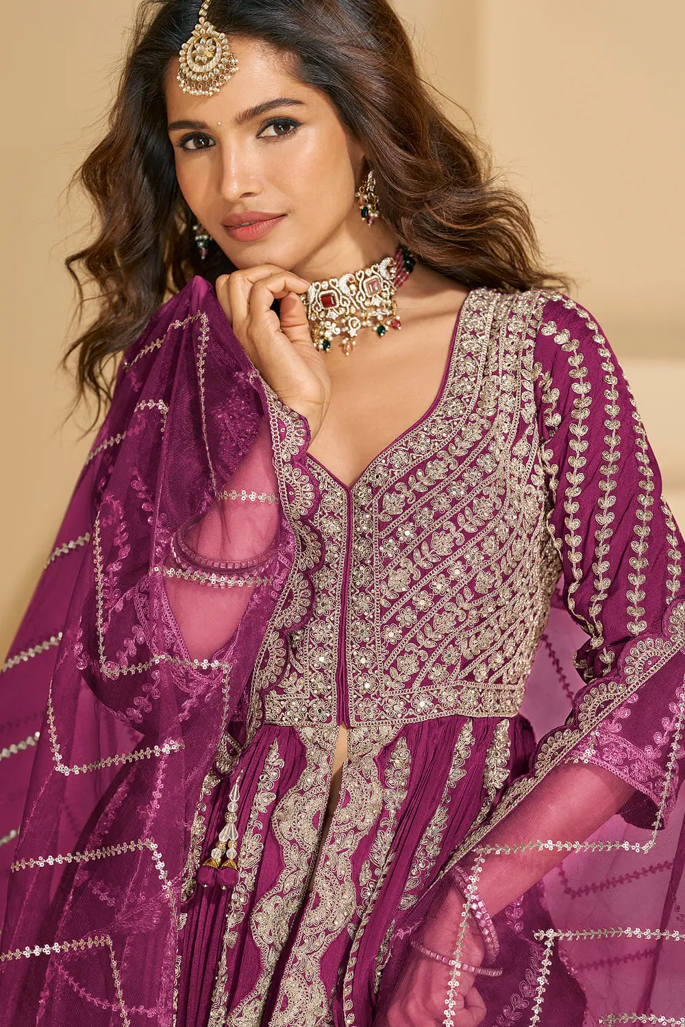Detailed close-up of the front bodice embroidery on the vibrant hot pink chinon silk ethnic tunic.