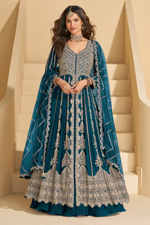 Elegant full front view of the teal blue chinon silk anarkali with skirt featuring heavy intricate embroidery.