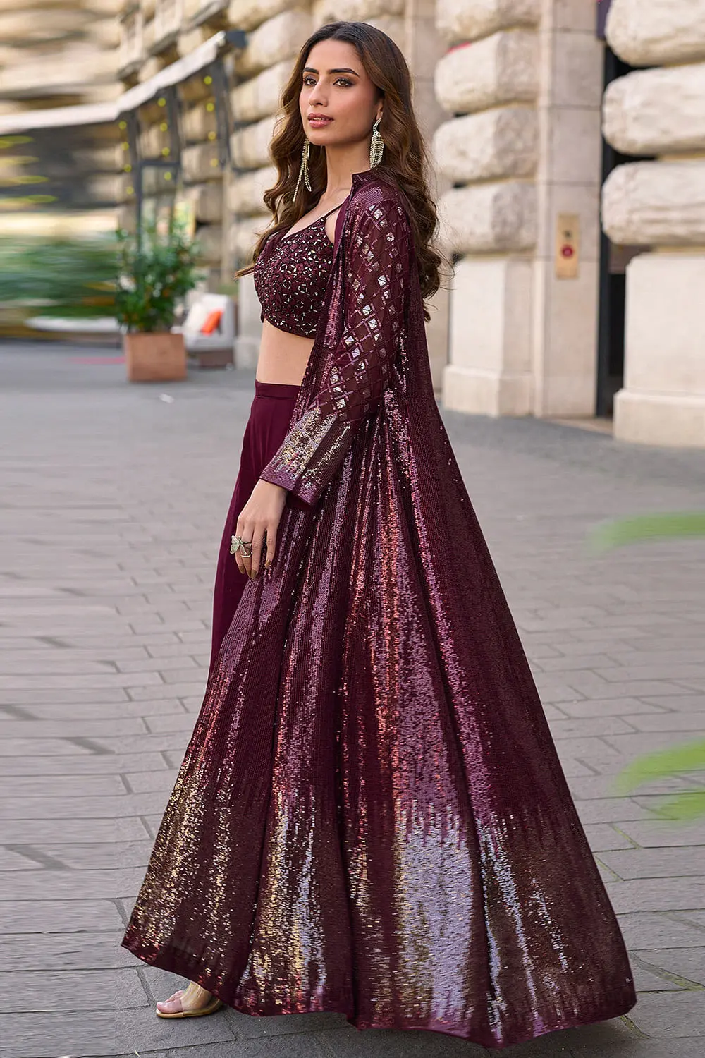 Side angle view of wine embroidered jacket palazzo set showing floor length jacket fall and palazzo width