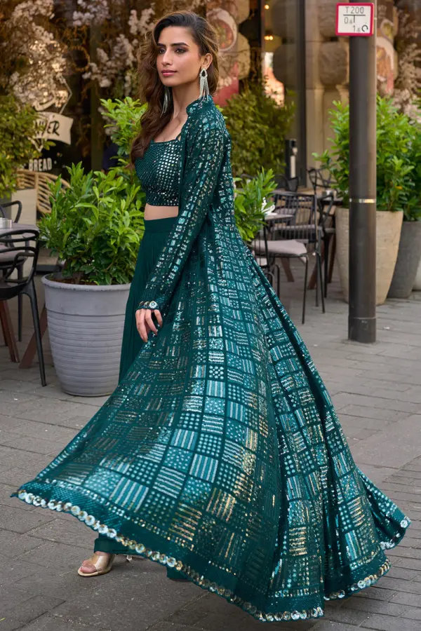 Side angle view of teal blue floor length georgette jacket showing unbroken fall from shoulder to hem
