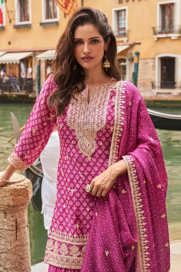 Close up showing digital print pattern and embroidery thread layered on magenta pink real silk kurta top
