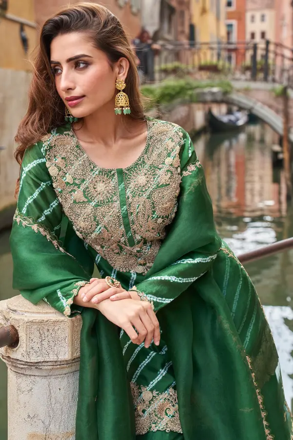 Close up of digital print tonal depth and embroidery thread on bottle green real silk kurta top