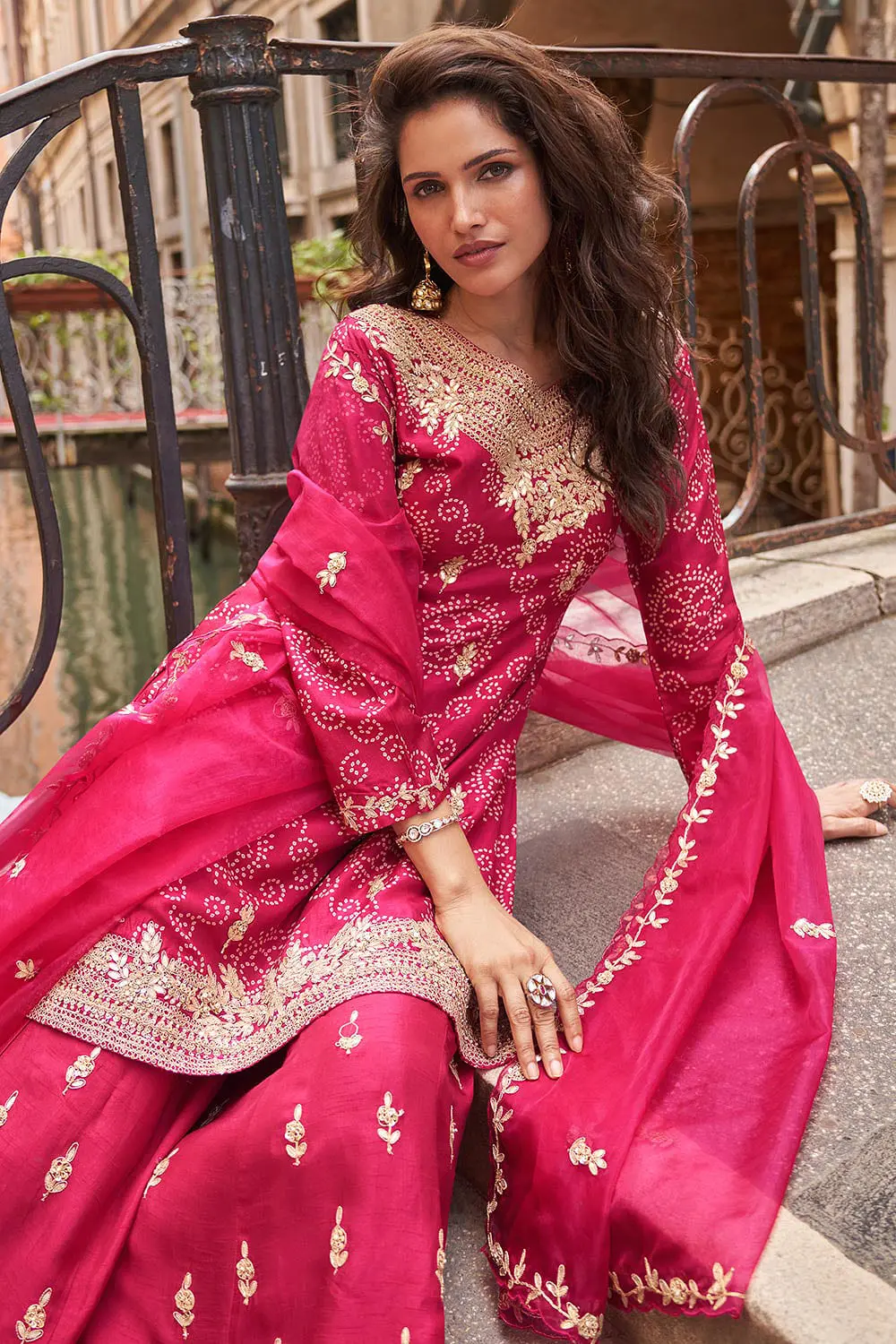 Digital embroidery detail on hot pink real silk kurta top — tonal surface variation visible in close up