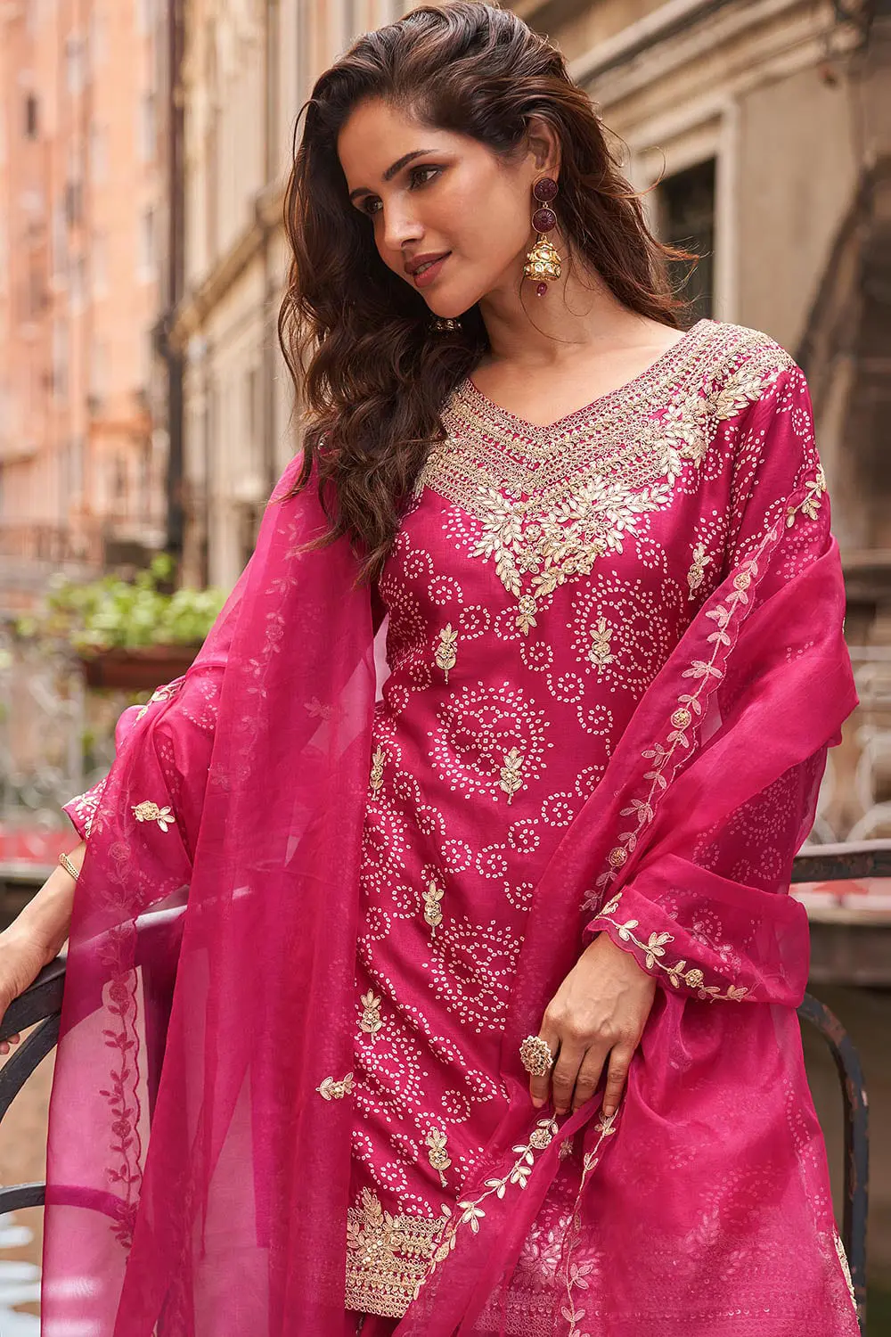 Embroidered silk dupatta alongside hot pink digital palazzo — thread work and silk sheen both visible