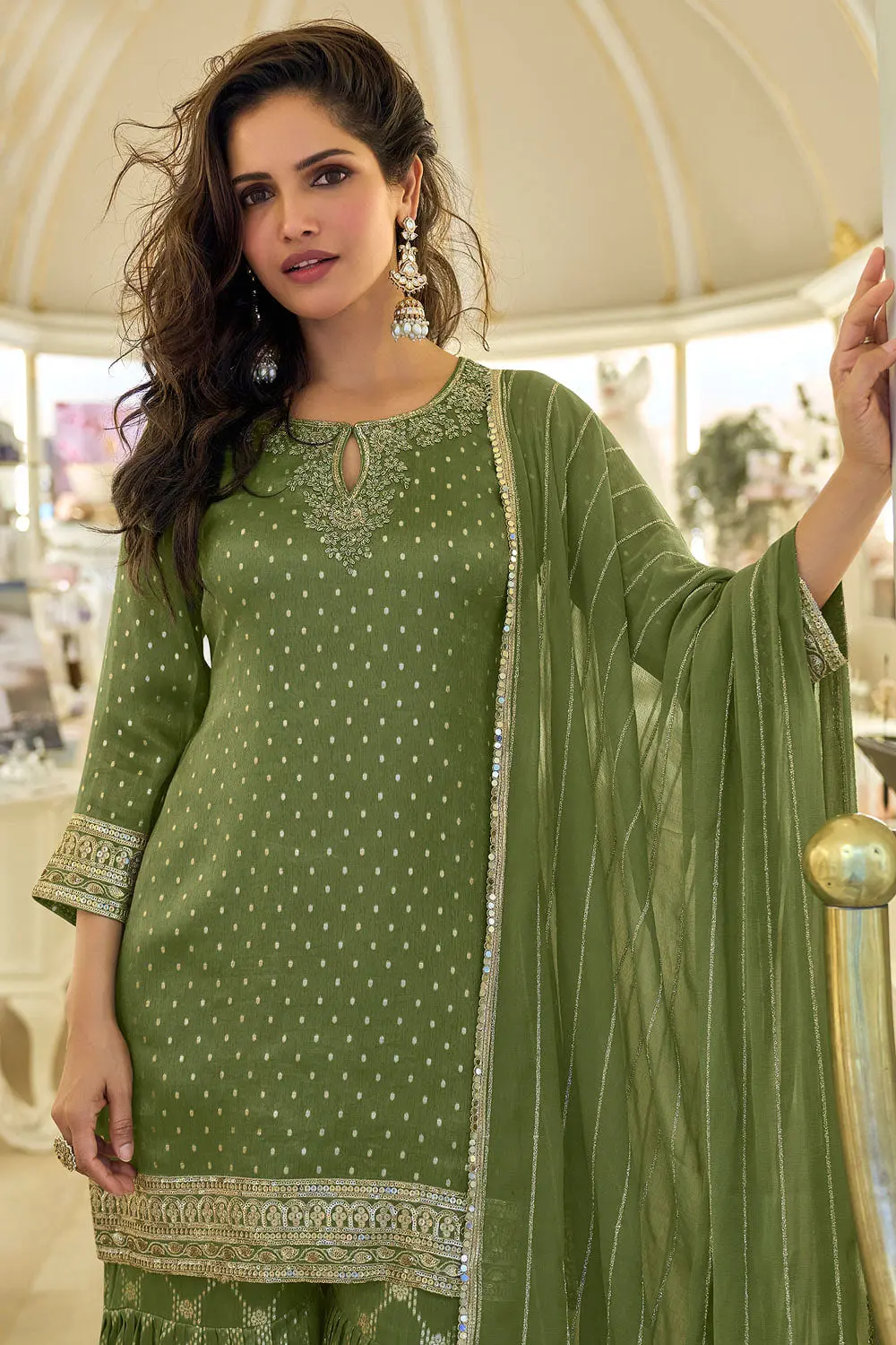 Close up of embroidered dupatta alongside green shimmer jacquard sharara set