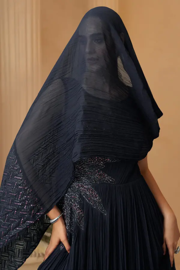 Close up of hand embroidery on purple chinon silk cape style gown